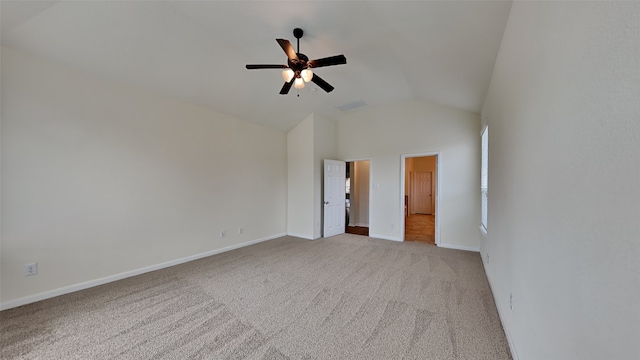 unfurnished room featuring lofted ceiling, ceiling fan, and light colored carpet