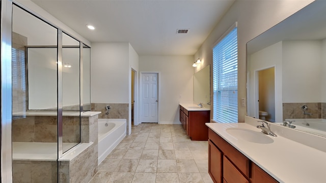 full bathroom with vanity, toilet, and plus walk in shower