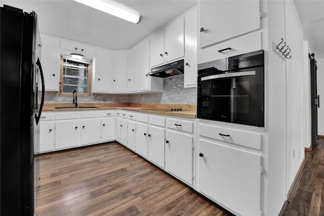 kitchen featuring dark wood-type flooring, sink, white cabinetry, and black appliances