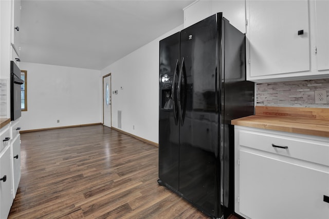 kitchen featuring white cabinets, black appliances, dark wood-type flooring, and backsplash