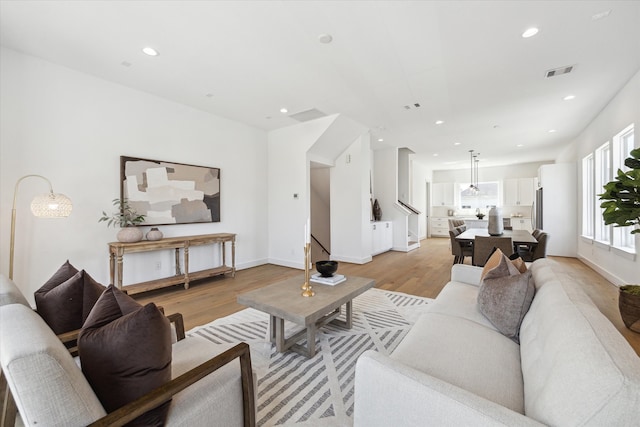 living room with light hardwood / wood-style flooring