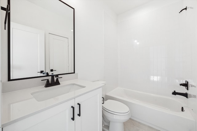 full bathroom with tiled shower / bath, vanity, toilet, and tile patterned floors