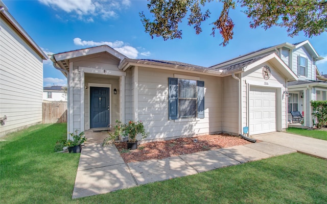 single story home with a front yard and a garage