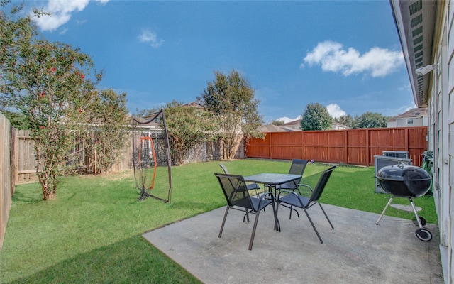 view of patio featuring a grill