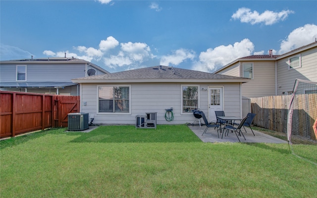 back of property featuring a patio, cooling unit, and a yard