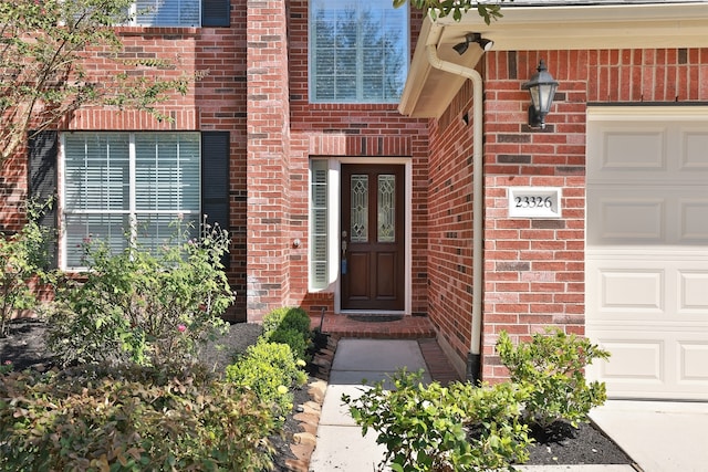 property entrance with a garage