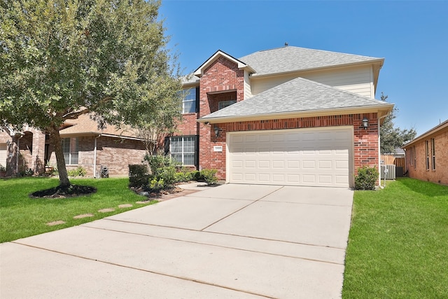 view of front of house with central AC, a front lawn, and a garage