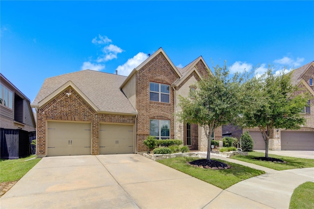 view of front of home featuring a front lawn and a garage