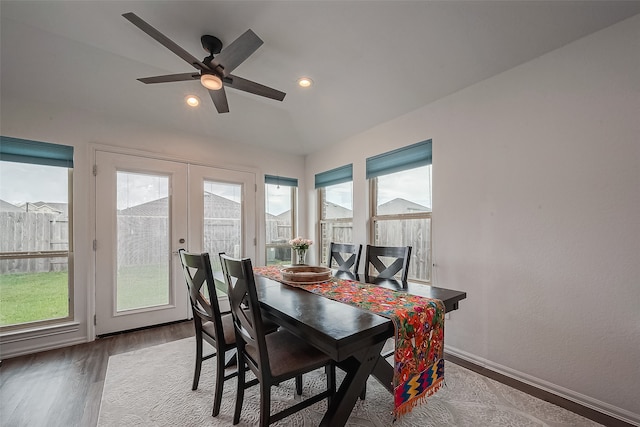 dining room featuring ceiling fan, plenty of natural light, french doors, and wood-type flooring