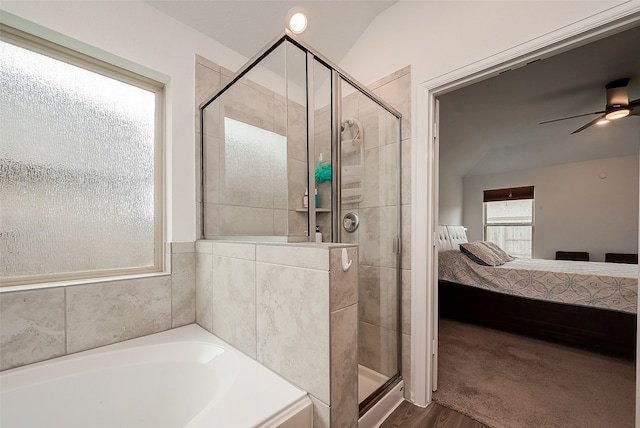 bathroom with hardwood / wood-style floors, separate shower and tub, and ceiling fan