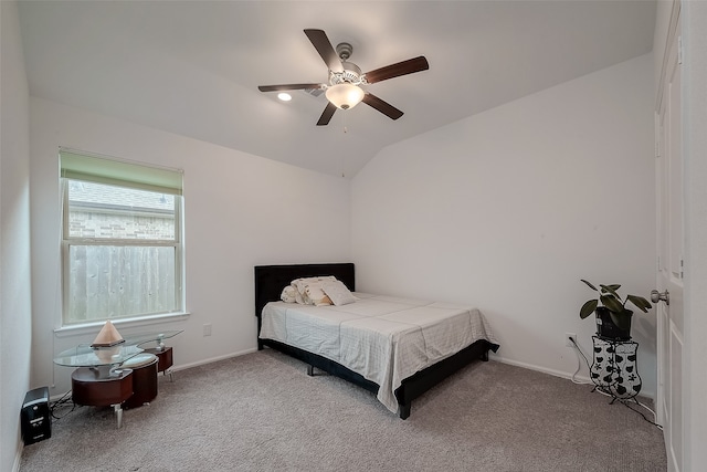 bedroom with lofted ceiling, ceiling fan, and carpet floors