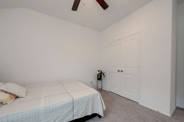 bedroom featuring ceiling fan, lofted ceiling, and carpet