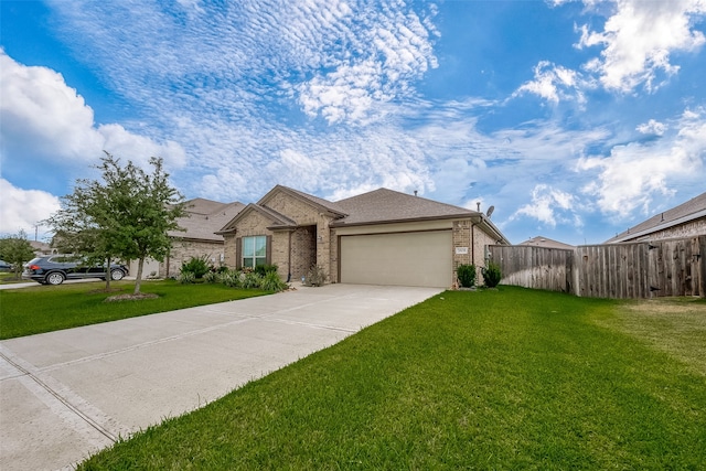 view of front of home with a front yard and a garage