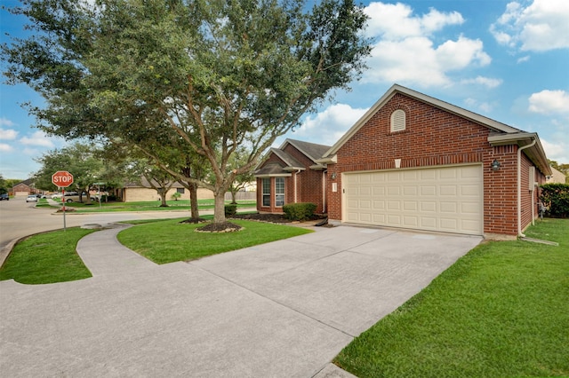 view of front facade with a front yard and a garage