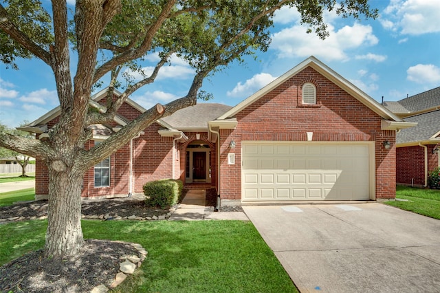 view of front of house featuring a garage and a front lawn