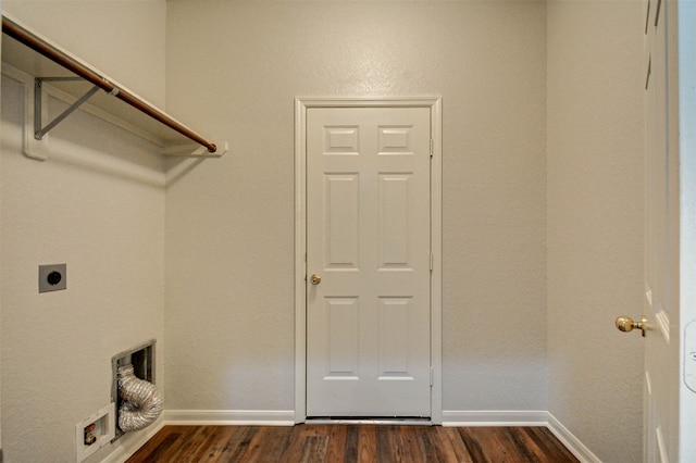 laundry room with hookup for an electric dryer and dark wood-type flooring