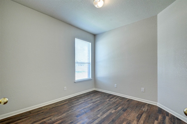 empty room with dark hardwood / wood-style floors