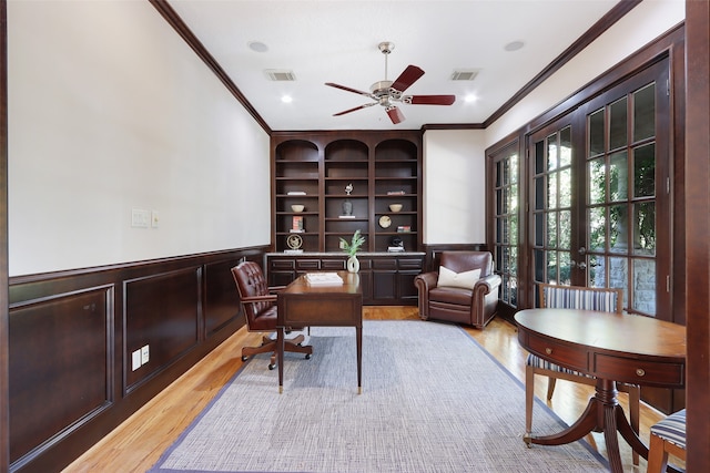 office area featuring ornamental molding, light hardwood / wood-style flooring, and ceiling fan