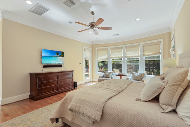 bedroom with ceiling fan, crown molding, and light wood-type flooring