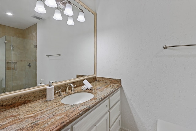 bathroom with vanity and walk in shower