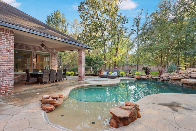 view of pool featuring a patio and ceiling fan