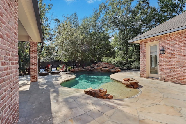 view of pool with a patio