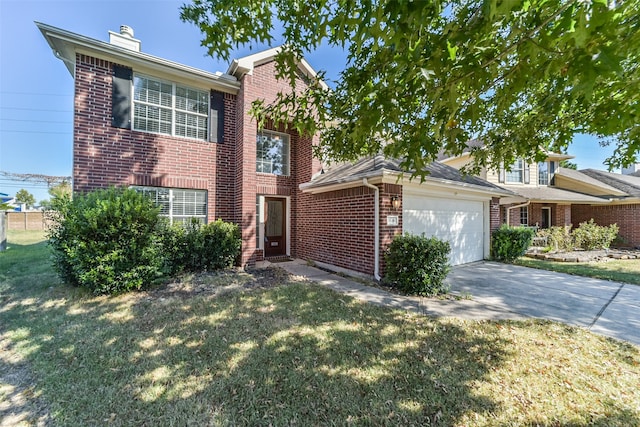 view of front of home featuring a front lawn and a garage