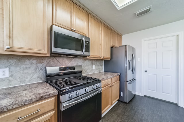 kitchen with decorative backsplash, stainless steel appliances, light brown cabinetry, and dark hardwood / wood-style floors