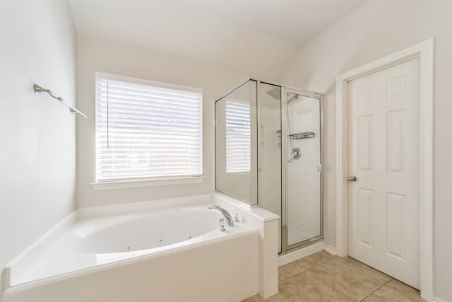 bathroom with independent shower and bath and tile patterned flooring