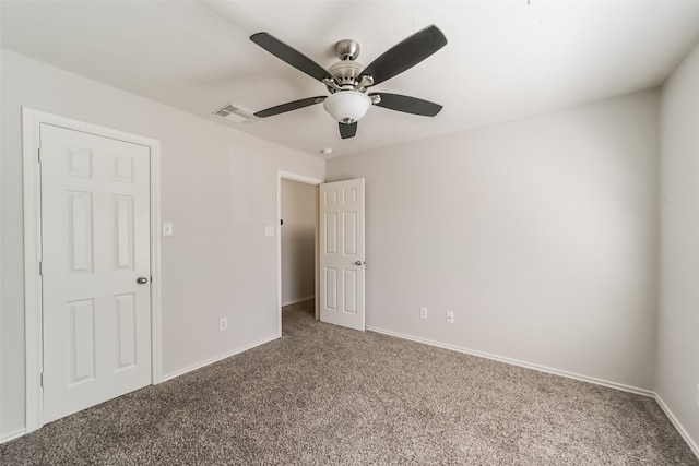 unfurnished bedroom featuring ceiling fan and carpet