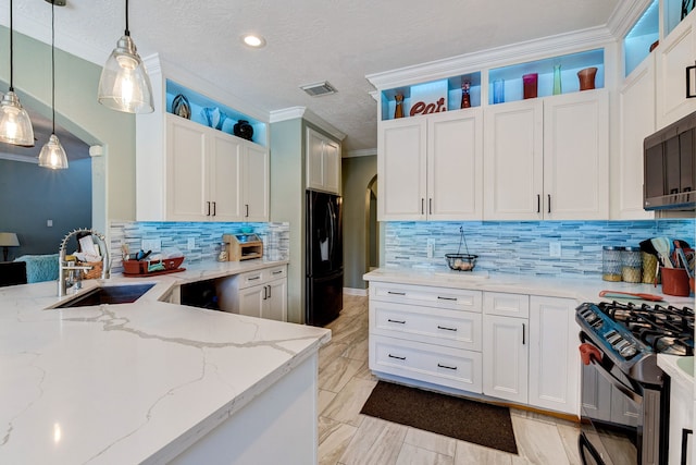 kitchen featuring black appliances, hanging light fixtures, light stone counters, and white cabinets