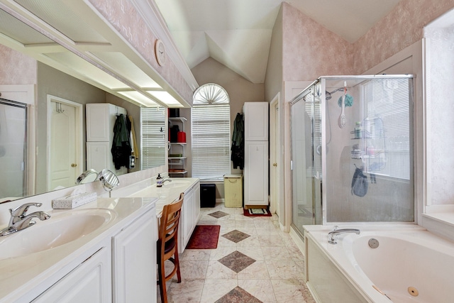 bathroom with shower with separate bathtub, lofted ceiling, and vanity