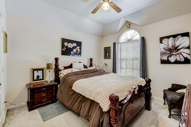 carpeted bedroom featuring ceiling fan and a textured ceiling