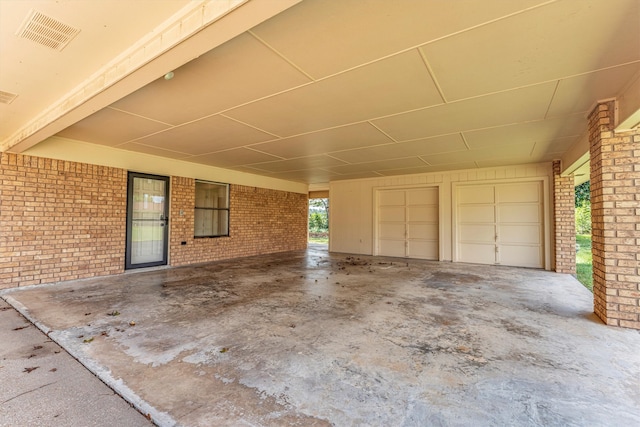 view of patio with a garage