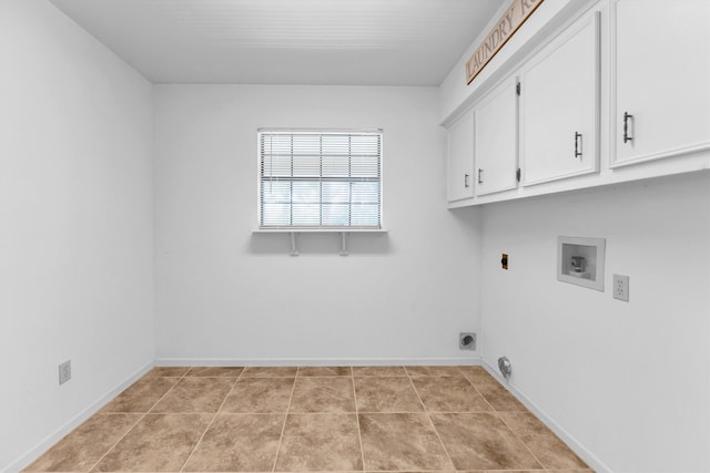 laundry room featuring cabinets, hookup for an electric dryer, hookup for a washing machine, and light tile patterned floors