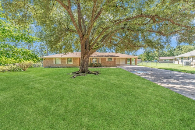 ranch-style home with a front yard