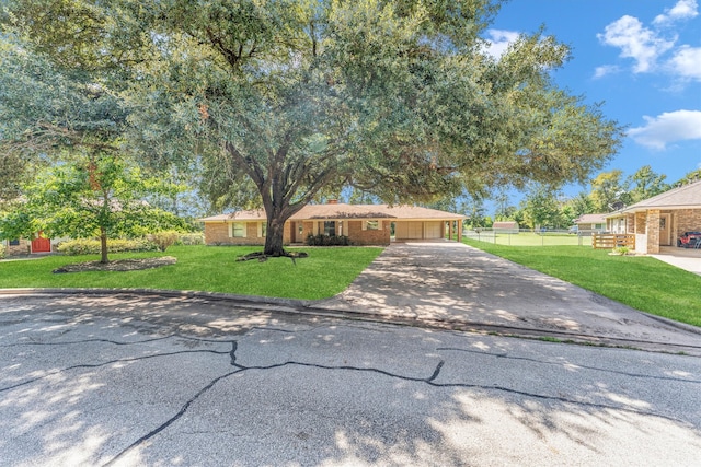 ranch-style house with a front yard