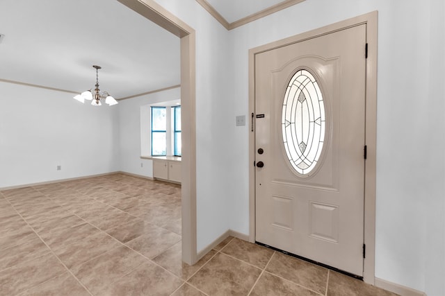 tiled foyer with crown molding and an inviting chandelier