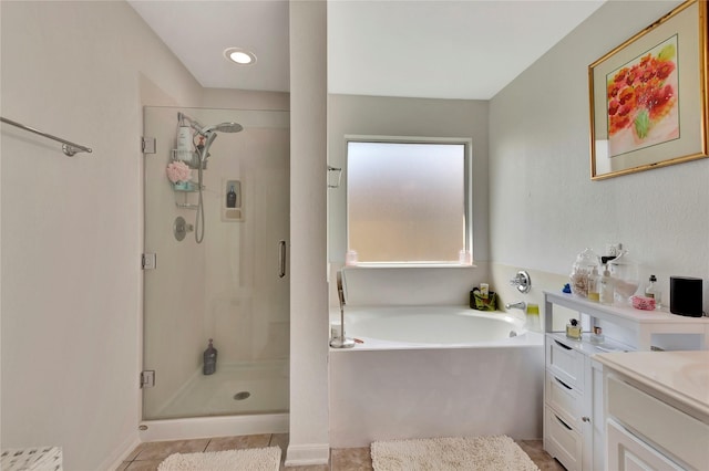 bathroom featuring tile patterned flooring, vanity, and independent shower and bath