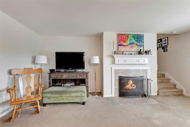 carpeted living room with a fireplace