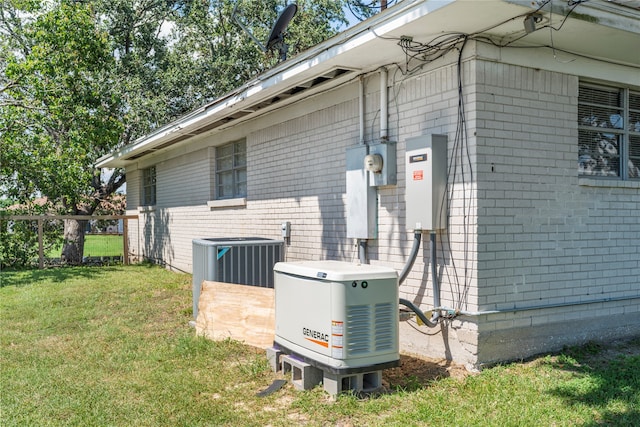 view of home's exterior with central air condition unit and a lawn