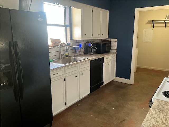 kitchen featuring sink, white cabinetry, decorative backsplash, and black appliances