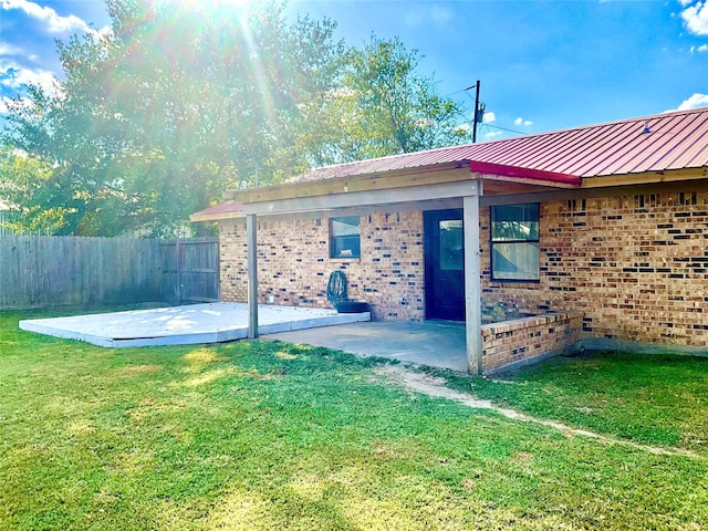 exterior space with a yard and a patio