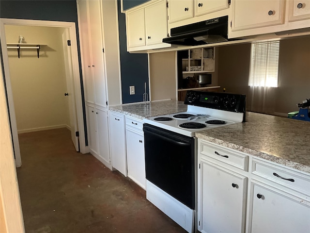 kitchen with white cabinets and white range with electric cooktop