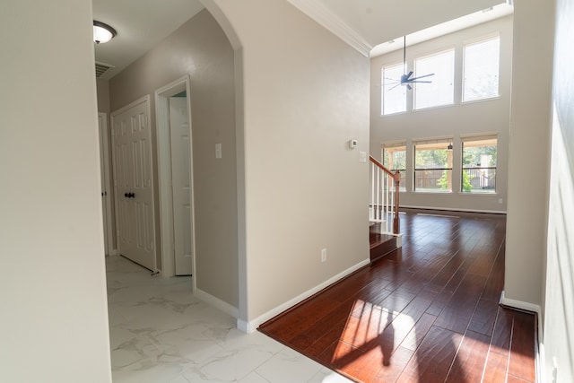 hall featuring crown molding and hardwood / wood-style flooring