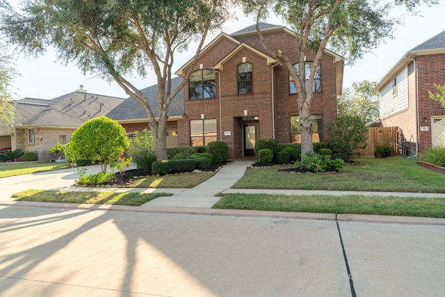 view of property featuring a front yard