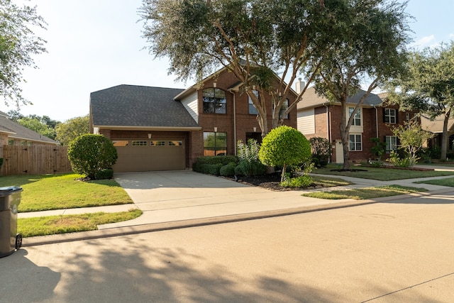 front of property featuring a garage and a front lawn