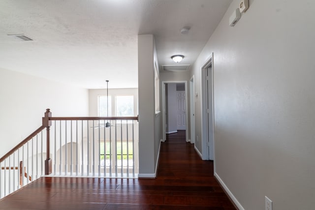 hall with dark wood-type flooring