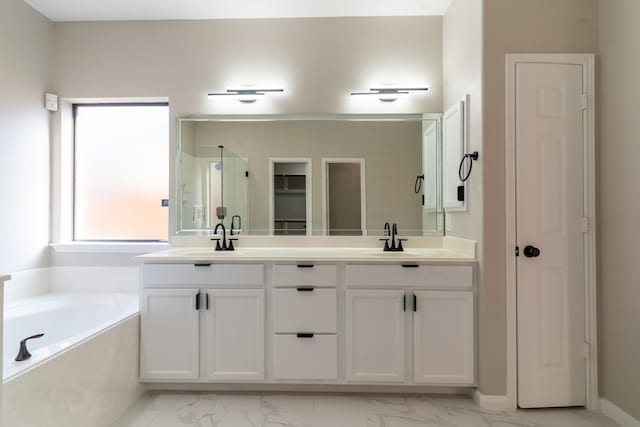 bathroom with independent shower and bath and vanity