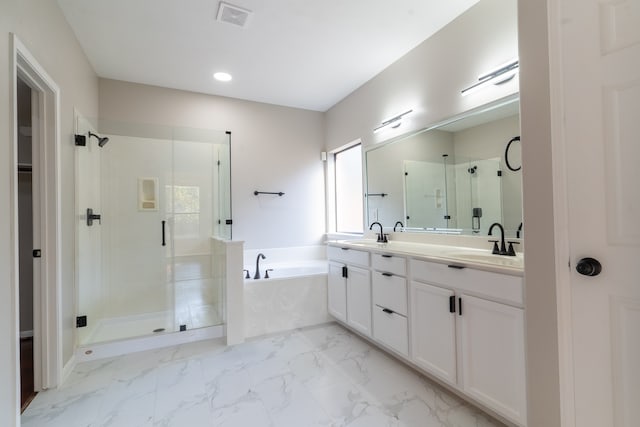 bathroom with vanity and separate shower and tub